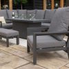 Manhattan Reclining Corner Dining Set with Fire Pit Table & Armchair with the focus on the armchair and the rest of the set in the background