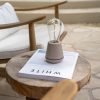 Humble One Table Light IP65/Outdoor on a table outdoors