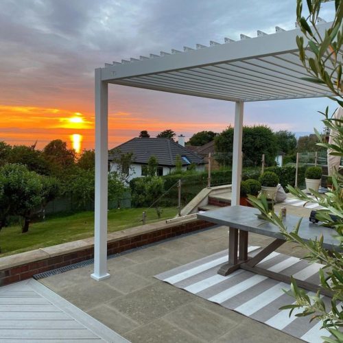 the 4m x 3m white pergola with the sunset in the background