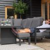 Manhattan Reclining Aluminium Corner Dining Set - With Fire Pit Table side shot of the set with one person using the reclining sofa and bench for relaxation