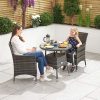 Amelia 2 Seat Bistro Set - 75cm Round Table with two family members using the set