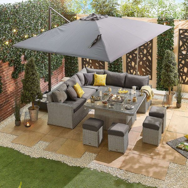 Deluxe Ciara Corner Dining Set with Firepit Table focus on the parasol being used with the set