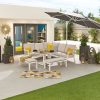 Compact Vogue Corner Dining Set with Rising Table and Benches zoomed out shot of the set with a parasol
